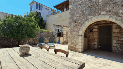 Stone courtyard of a traditional villa for sale in Vamos, Chania