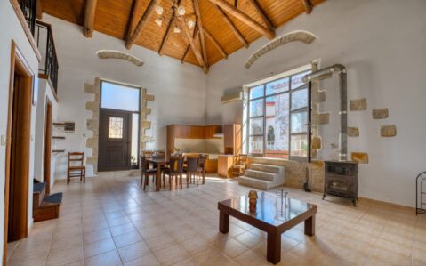 Interior of a renovated traditional olive mill house in Chania, Crete